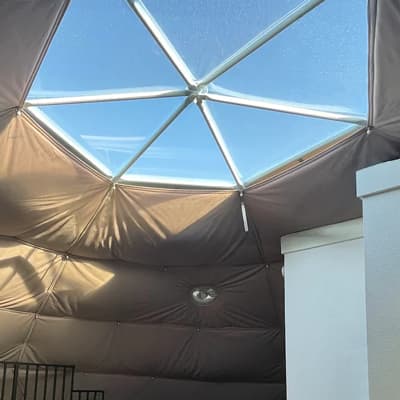 Framed skylight glazing above the lined interior of a Luna dome