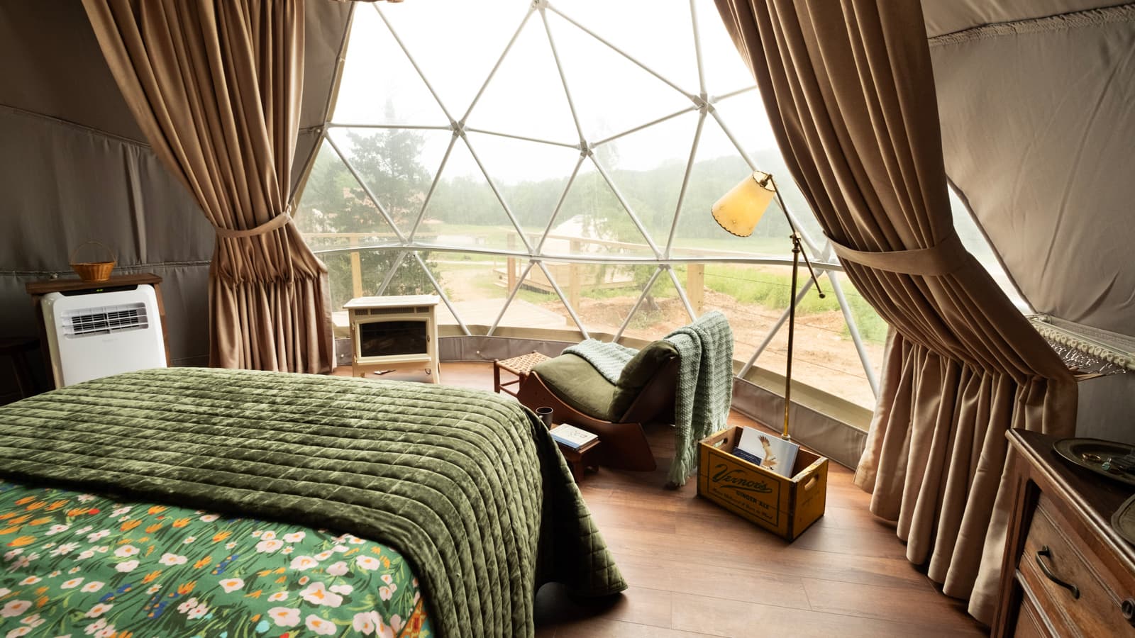 Geodesic dome against a natural landscape